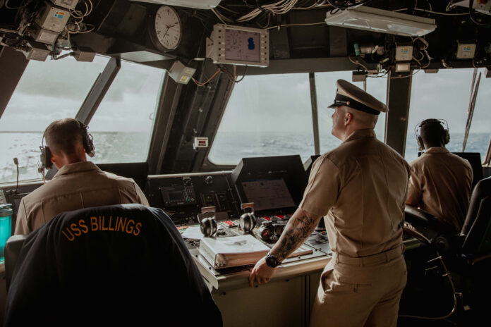 Chief petty officers keep watch on the bridge of the US Navy (USN) Freedom-class Littoral Combat Ship (LCS) USS Billings, in the Caribbean Sea in April 2022. The USN’s Freedom-class LCS vessels are fitted with the Lockheed Martin COMBATSS-21 system as their combat management system (CMS). (US Navy)