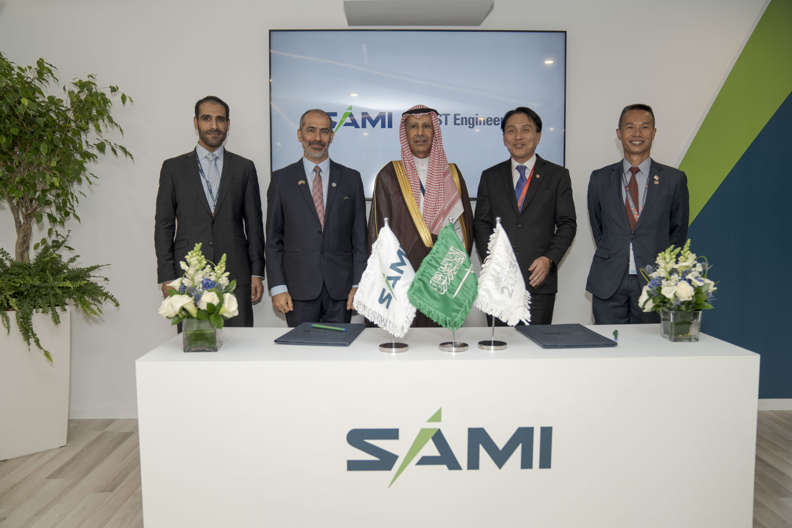 Representatives from SAMI and ST Engineering sign a Joint Venture at the Farnborough Airshow in July 2022.